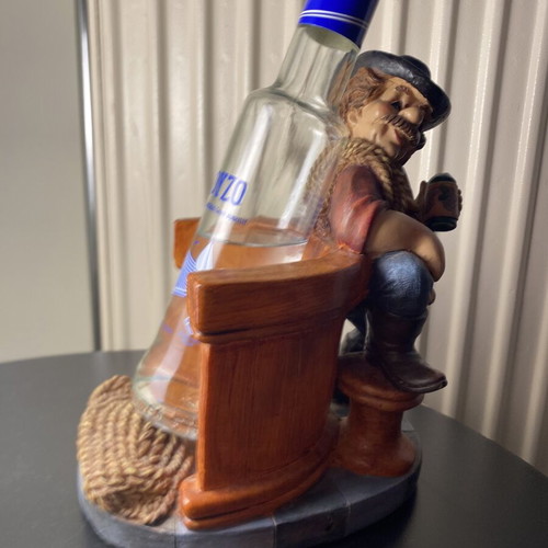 Resin figurine like new, bottle holder