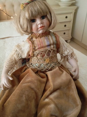 Vintage porcelain doll like new with velvet Victorian-style dress
