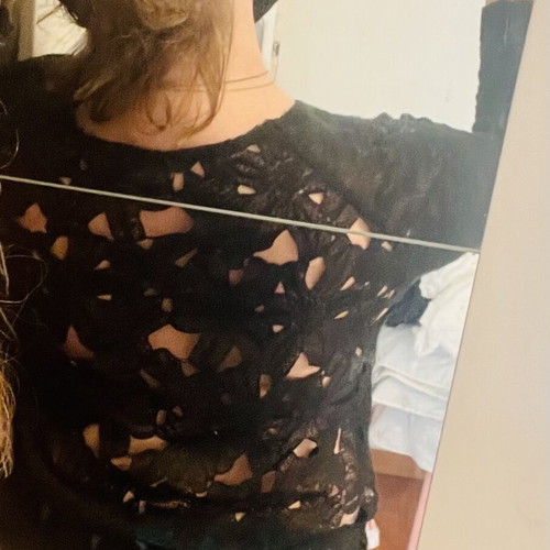 Thin knitted blouse with lace back