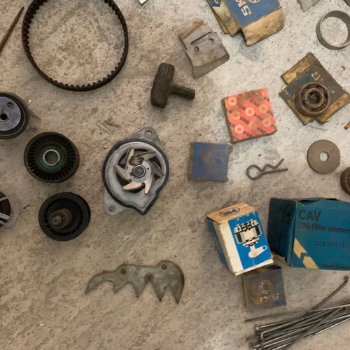 Various old chainsaw and small engine parts used