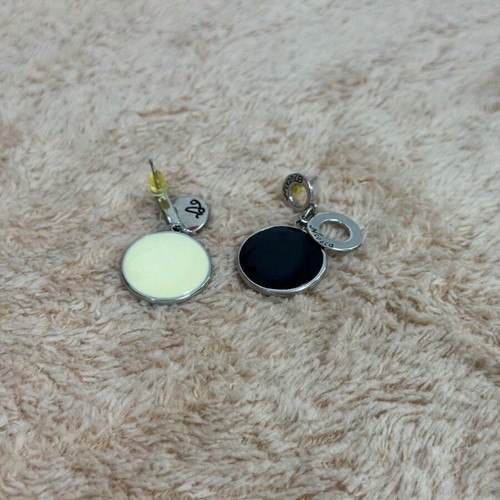 Asymmetrical design earrings like new, black and white