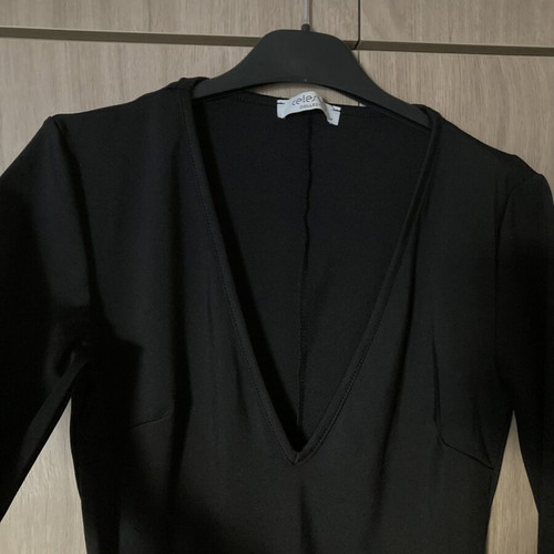 Celestino black fitted dress with deep V neckline like new
