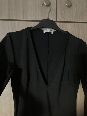 Celestino black fitted dress with deep V neckline like new