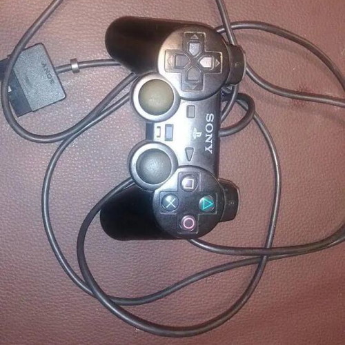 PlayStation 2 fat console with two games