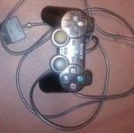 PlayStation 2 fat console with two games
