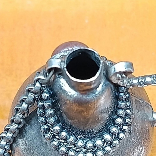 Perfume bottle antique like new, can be chained to necklace