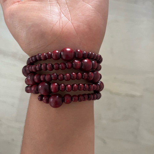 Wooden spiral bracelet like new with adjustable diameter and brown-red beads
