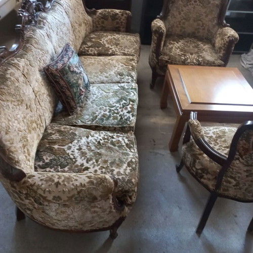 Classic antique living room set used with heavy wood carving and fabric upholstery