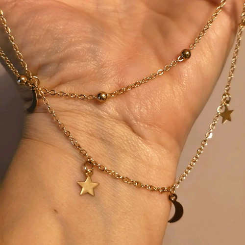 Double necklace in gold color like new with stars and crescent moons