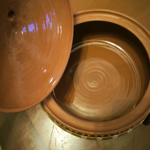 Hand-painted clay pot in excellent condition