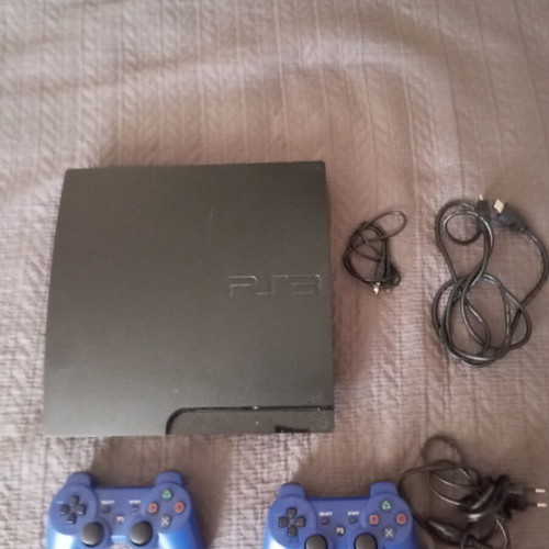 PlayStation 3 Slim console with 2 OEM controllers