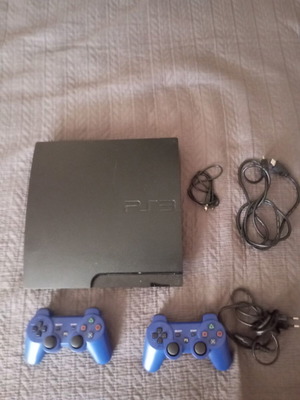 PlayStation 3 Slim console with 2 OEM controllers