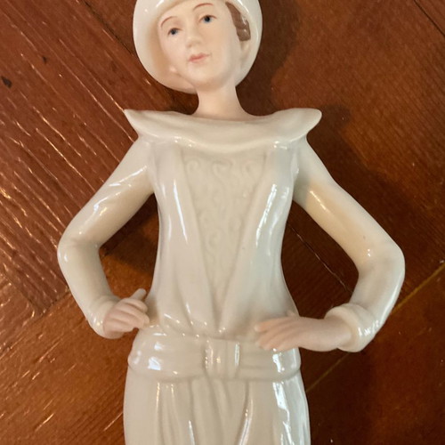 Regal Porcelain Statue