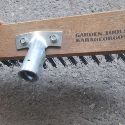 Street brush new with stiff bristles and metal handle