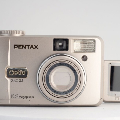 Pentax Optio 330GS 3.2MP vintage digital camera used with flip-up screen