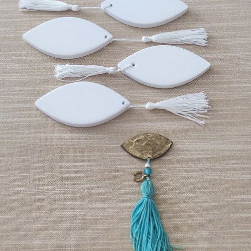 Ceramic gouria and metal eye charm set like new with blue beads and tassels