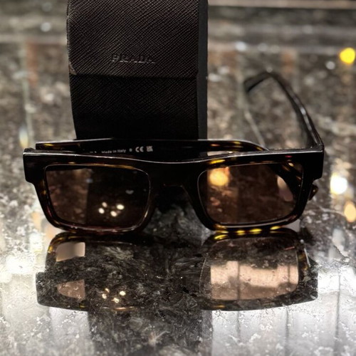 Prada sunglasses like new, unisex, black and brown
