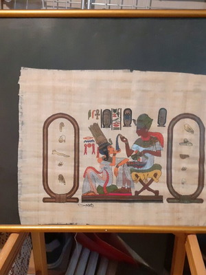Papyrus used with Egyptian design in frame