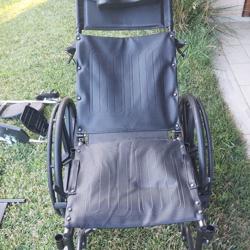Wheelchair with adjustable reclining backrest and cushion