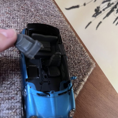 Toy cars, some unused, plastic and metal Mini Cooper