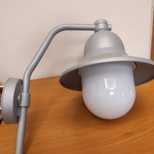 Wall-mounted cast outdoor sconce