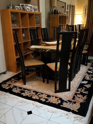 Dining set with glass table and wooden black base like new, 8 seats