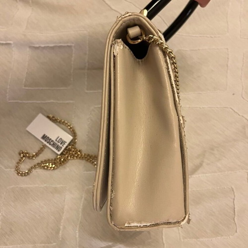Love Moschino clutch handbag used, beige with black handle