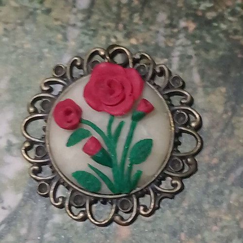 Handmade rose pendant with bronze frame