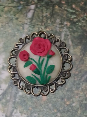 Handmade rose pendant with bronze frame