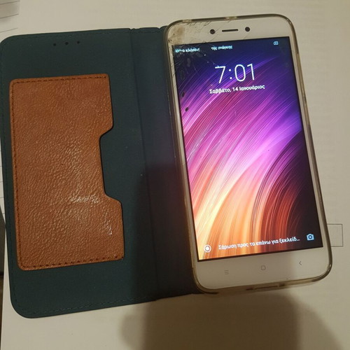 Xiaomi Redmi 4X smartphone with cracked screen, gold