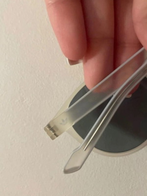 Adidas Originals sunglasses with transparent frame and purple mirror lenses