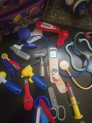 Dinosaur Bag with Various Used Children's Medical Accessories