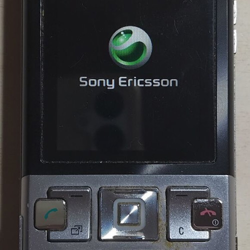 Sony Ericsson T700 phone used with charger and Memory Stick Micro