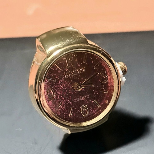 Quartz ring watch like new with purple dial and gold bracelet