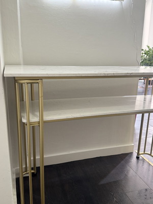 Desk console with metal frame and white marble-look surface