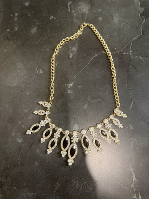 Women's gold necklace with black stones, used