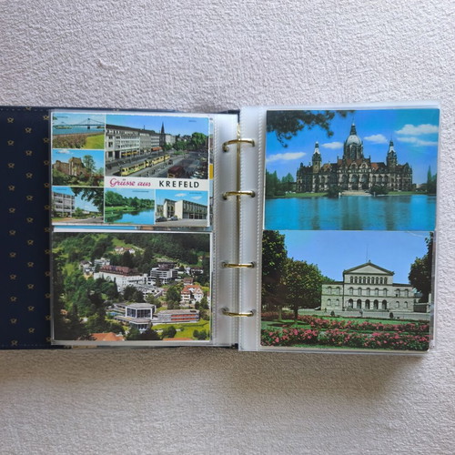 Postcard album like new with 200 postcards from around the world