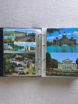 Postcard album like new with 200 postcards from around the world