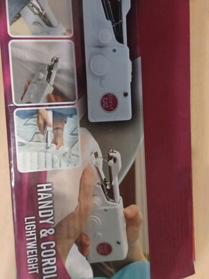 Handheld sewing machine like new