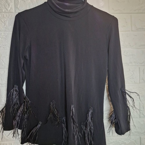 Turtleneck blouse with feathers like new