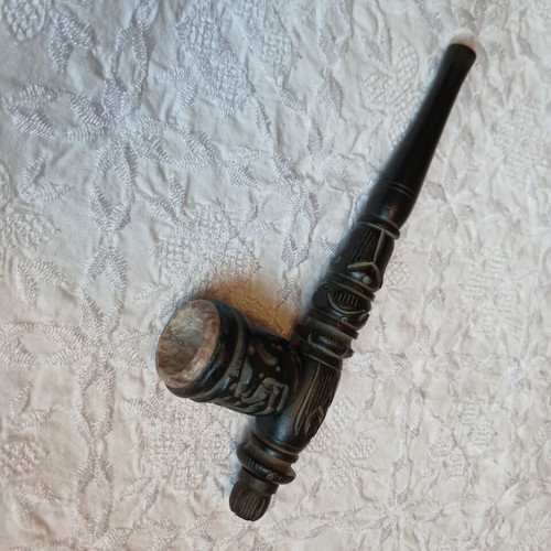 Handmade carved wooden pipe with stone inlay