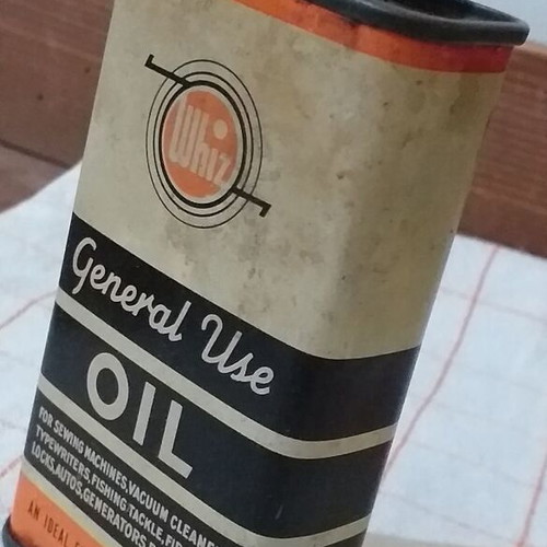Set of 4 used oil collectors with iron, tin, and plastic