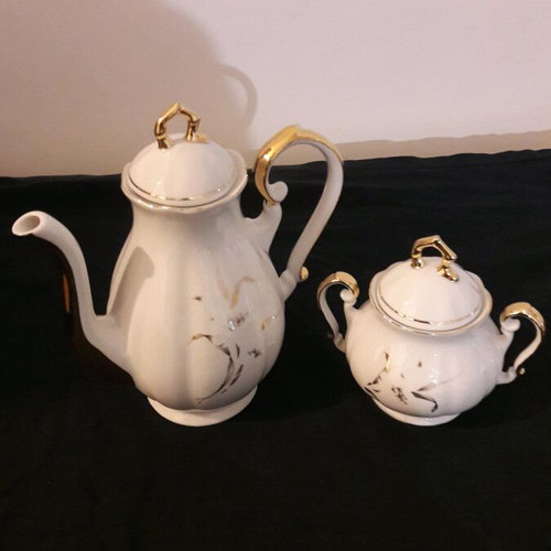 Vintage porcelain teapot and sugar bowl set like new