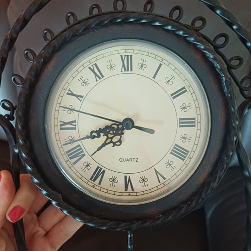 Vintage table clock with pendulum from wrought iron decorative