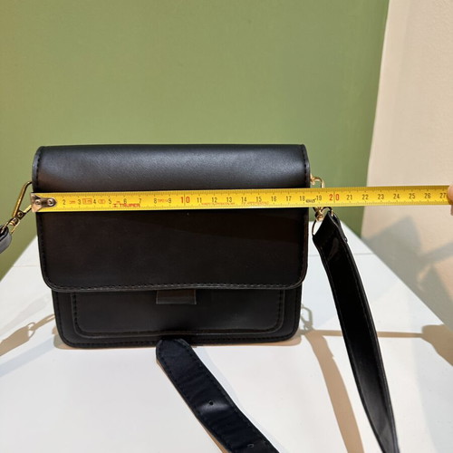 Black women's crossbody shoulder bag with gold details