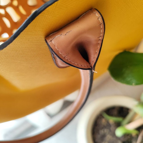 Yellow handbag used with beige details