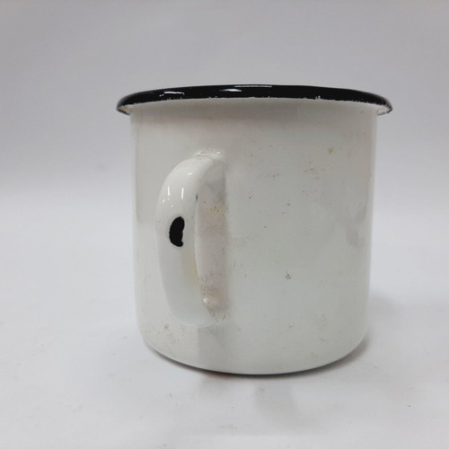 Vintage enamel metal mug with floral motif