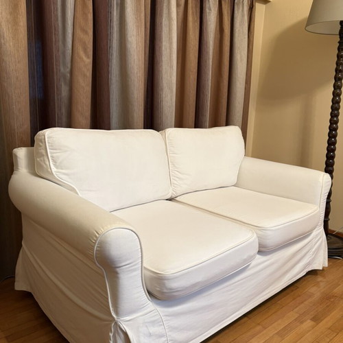 Two-seater sofa with white fabric cover like new