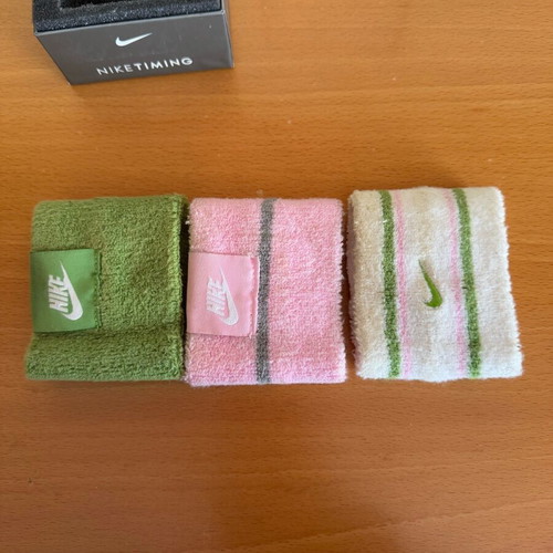 Nike sports watch used with white, green and pink wristband