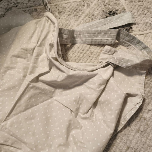 Nursing cover with storage pouch used